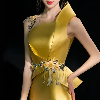 Zelta vakara kleita sieviete ir 2021. jaunā banketu temperamentu ilgi zivs astei līdzīgs saimnieka gada puse sniegumu kleita